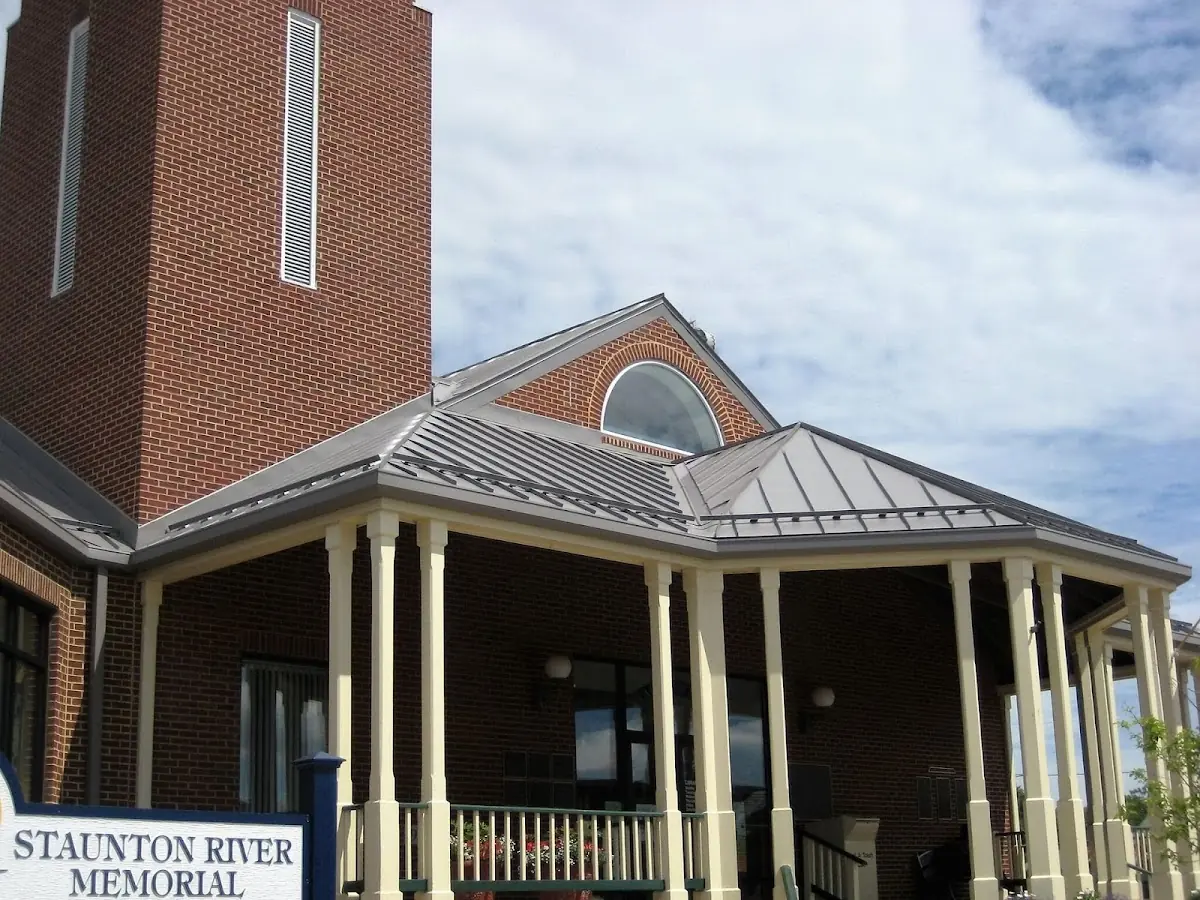 Skilled roofing craftsmen working on a residential roof in Charleston